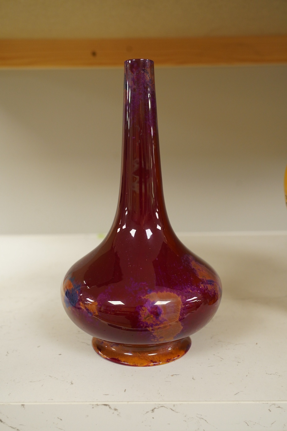 An early Royal Doulton flambé lustre bottle vase, early 20th century, 24cm high. Condition - good